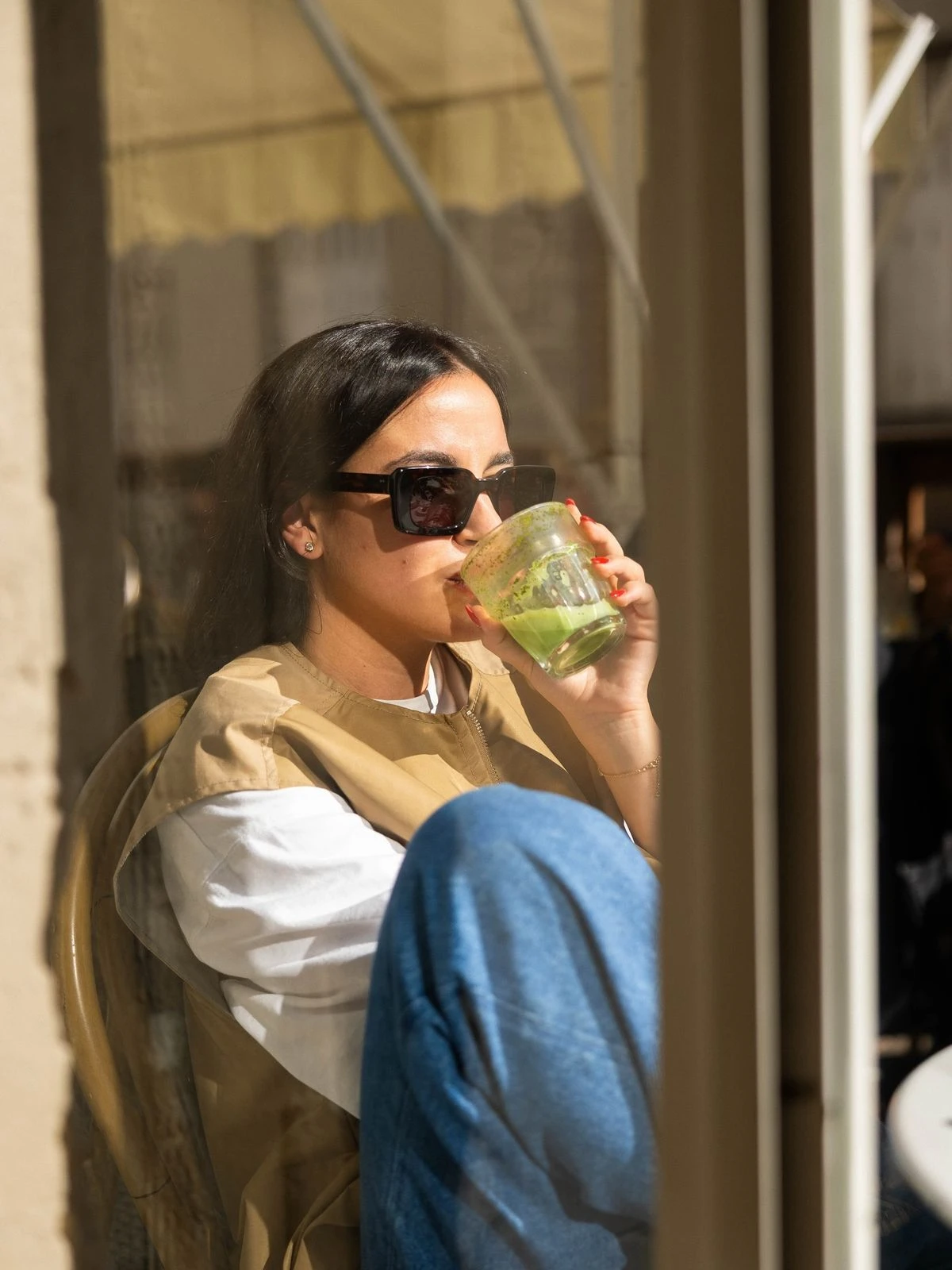Customer enjoying a drink in warm natural light